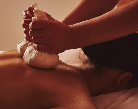A model having a massage at Claridge's Spa, using Claridge's Spa home made poultices