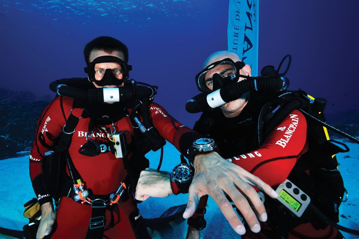 Biologist Laurent Ballesta and Mark A. Hayek diving in French Polynesia